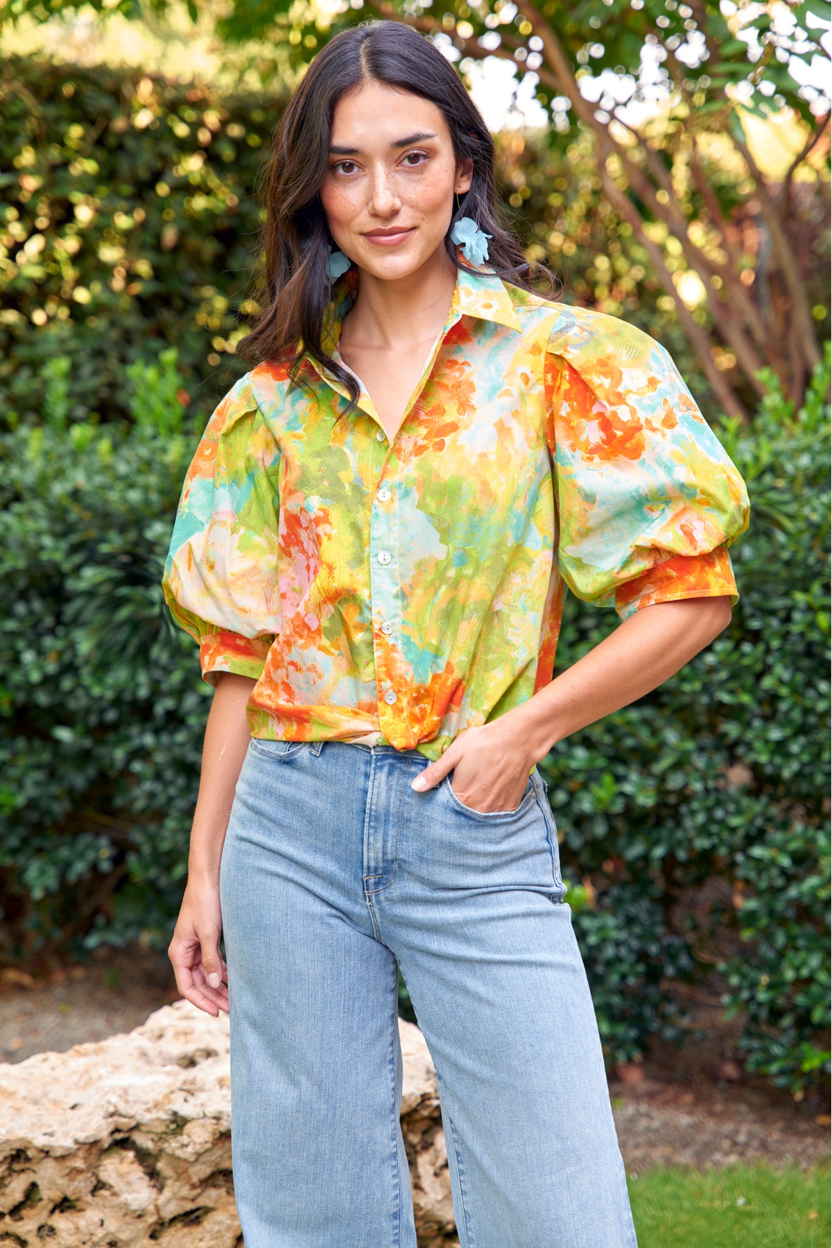 Model wears Finley Bomba Monet floral print cotton shirt with twist hem and elbow blouson sleeves.1 Cropped, relaxed fit.