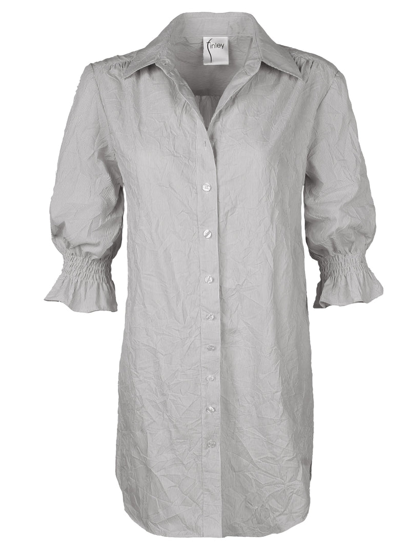 A frontal view of the Finley Miller shirt dress, a tan weathercloth button down designer shirt dress with a relaxed fit.
