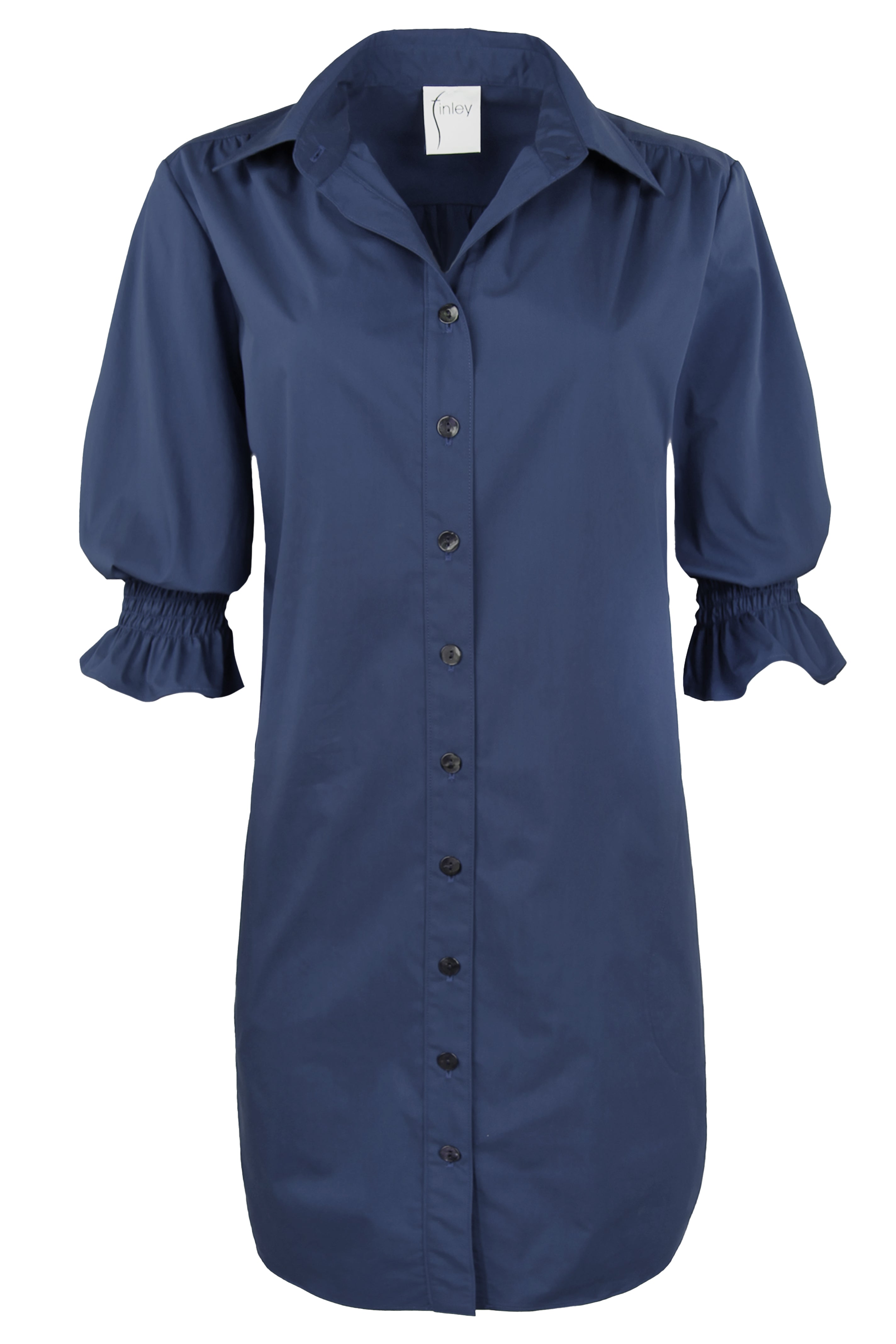 A front view of the Finley Miller shirt dress, a navy weathercloth midi shirt dress with elbow puff sleeves and inseam side pockets.