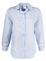 A front view of the Finley Niko blouse, a pale blue chambray linen boyfriend shirt with a chest pocket and a relaxed fit.