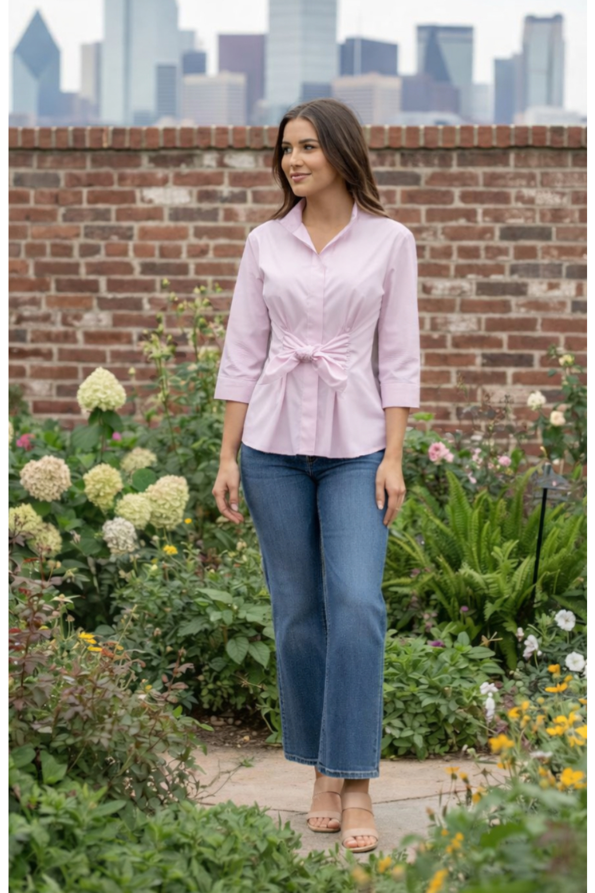 Model wearing the Finley Rocky blouse, a tie front relaxed fit poplin pink blouse