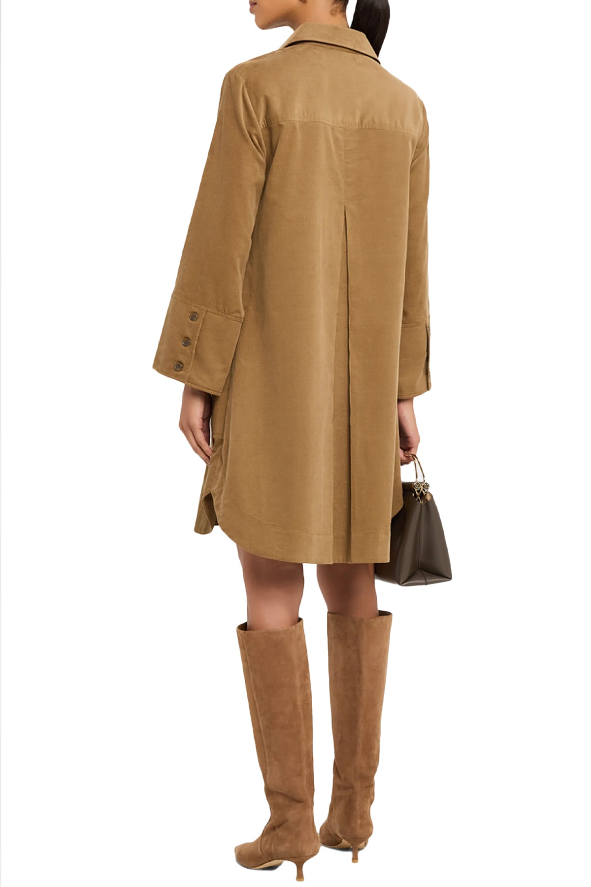 Woman wearing a beige coat and matching knee-high boots on a white background