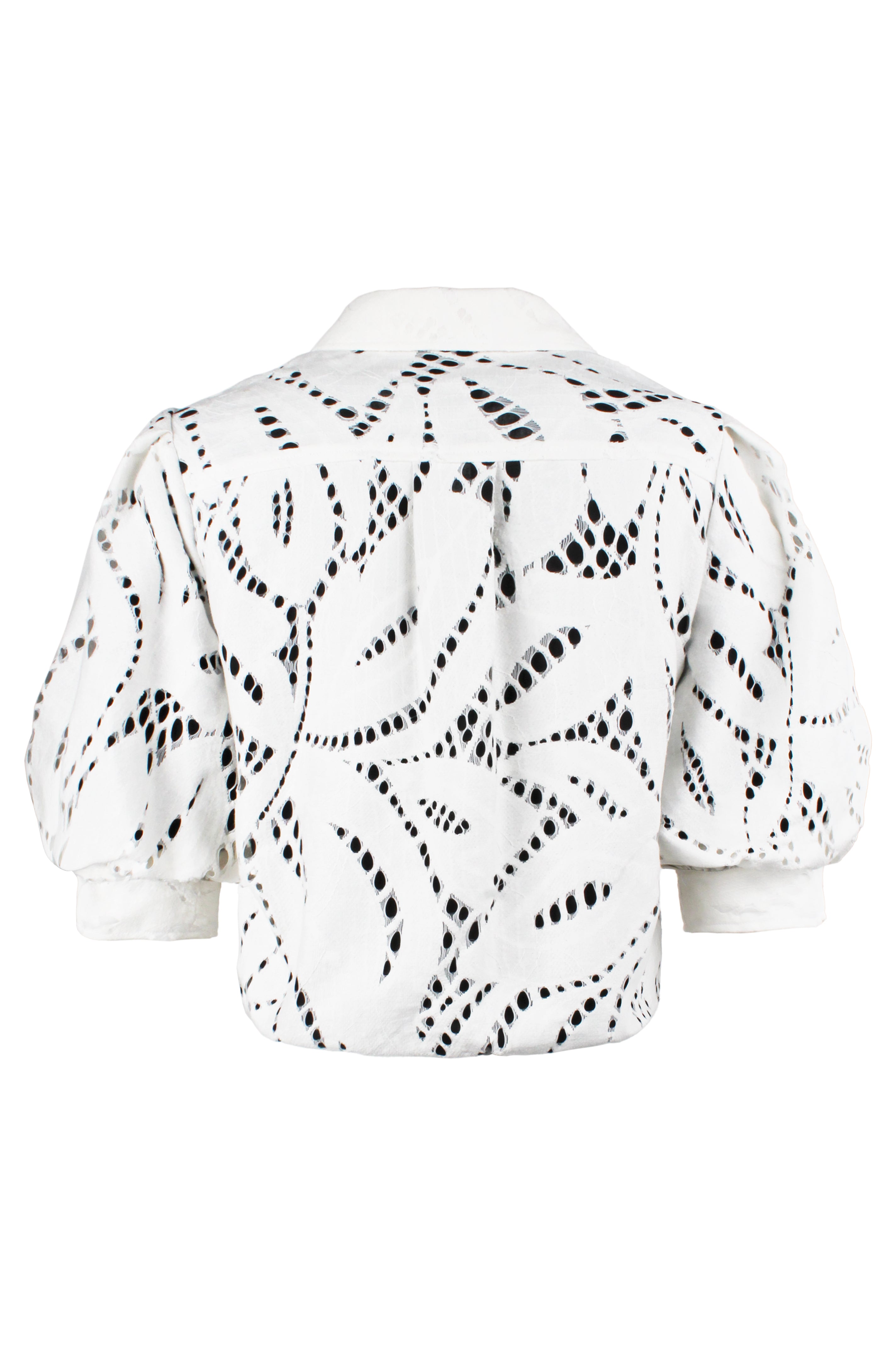 White blouse with black abstract pattern on a white background