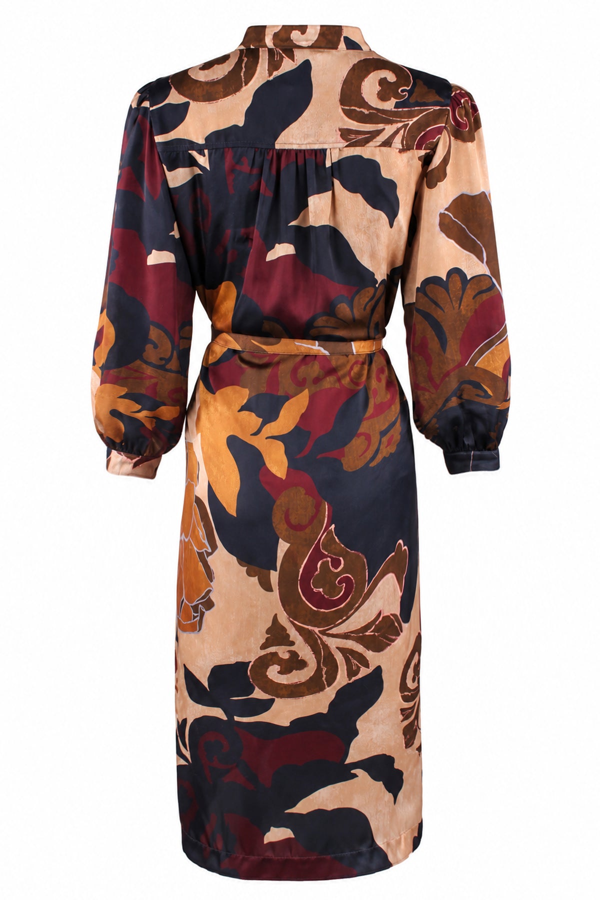 A long-sleeve midi dress with a shawl collar and a self-tie waist belt, featuring an abstract floral and paisley pattern in beige, brown, burgundy, and navy blue on a white background.