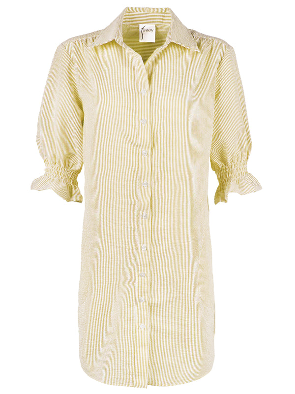 The Finley Miller dress, a yellow seersucker shirt dress with puff sleeves, a spread collar, and pockets.
