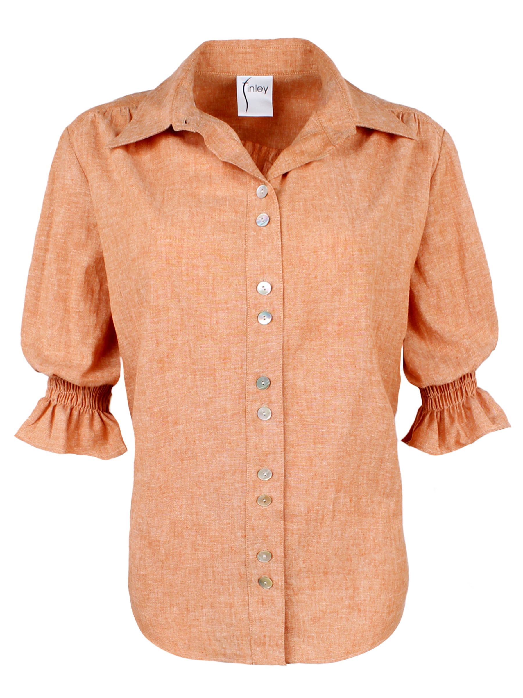 A front view of the Sirena shirt in rust orange, featuring elbow-length puff sleeves, a hemp cotton blend, spread collar, and a relaxed shape.