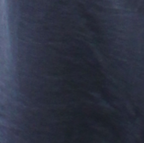 A close-up texture shot of a dark navy blue fabric, showing a fine woven pattern.
