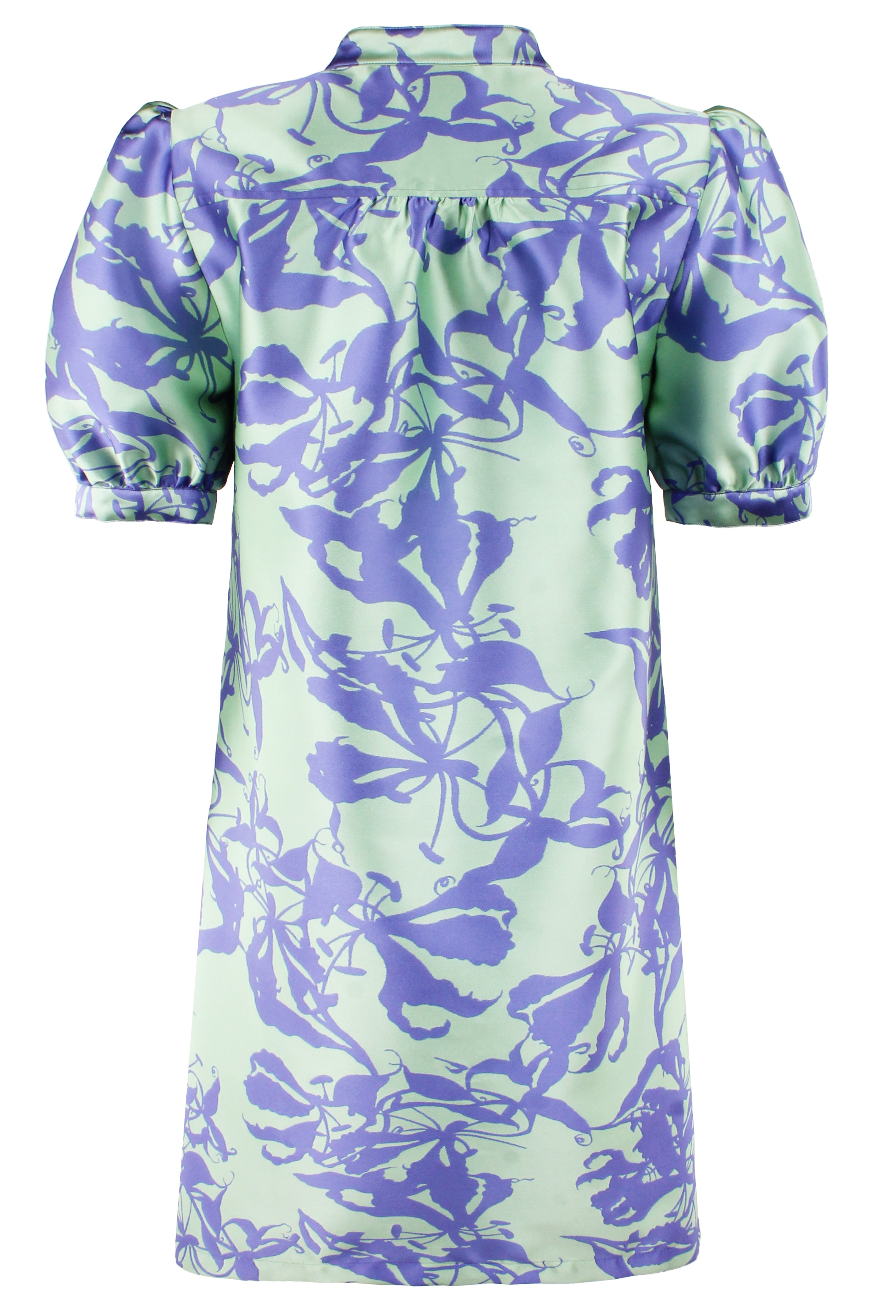 Green dress with purple floral pattern on a white background