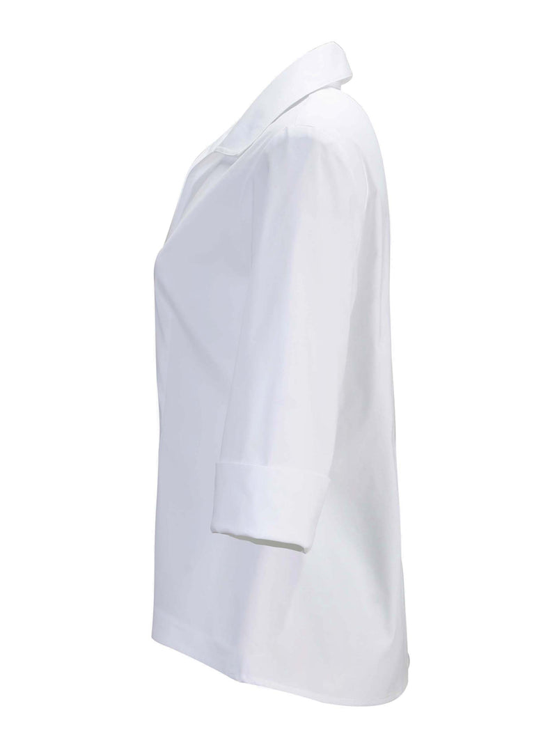 A profile view of The Finley swing shirt, a white 3/4 sleeve blouse with a turnback collar and a rear inverted pleat.