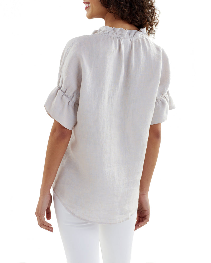 The Finley Crosby blouse, a Caribbean blue short-sleeve washed linen blouse with ruffle collar detail and relaxed fit.