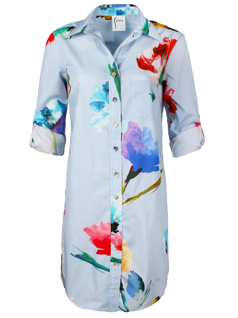 A front view of the Finley Alex shirt dress, a sky blue 100% cotton shirt dress with a floral print and a relaxed contour.