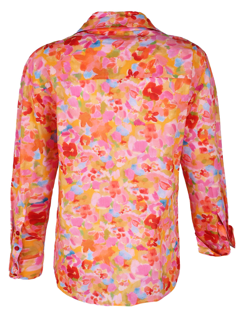 A rear view of the Finley Andie blouse, a cotton button down pink and orange floral blouse with a relaxed contour