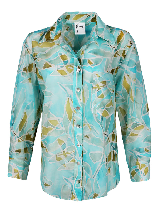A front view of the Finley Andie shirt, a cotton voile long sleeve button down blouse with a blue tropical print.
