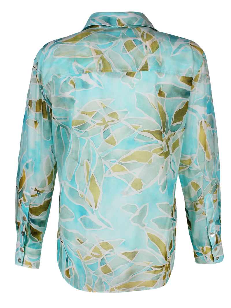 A rear view of the Finley Andie shirt, a cotton voile long sleeve button down blouse with a blue tropical print.