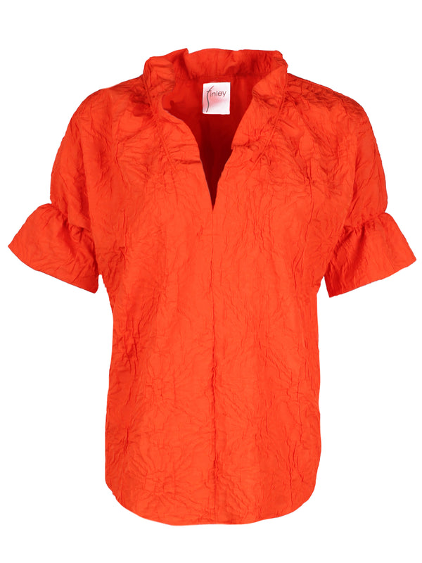 A front view of the Finley Crosby blouse, a short sleeve ruffle trim women's blouse in a textured orange jacquard.