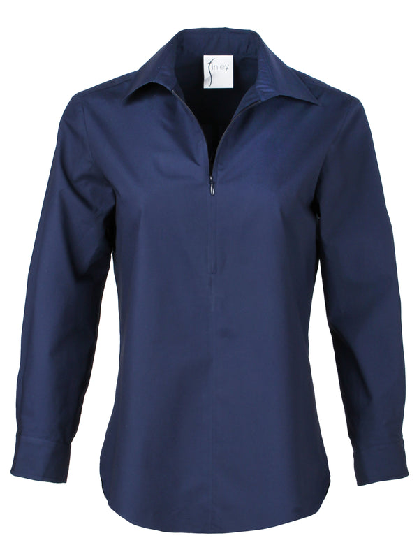 A model wearing the Finley Endora, a half-zip 100% cotton sateen stretch poplin pullover blouse in navy.