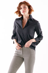 A supermodel wearing the Finley Endora shirt, a black blouse with a half-zip collar and a semi-tailored fit.