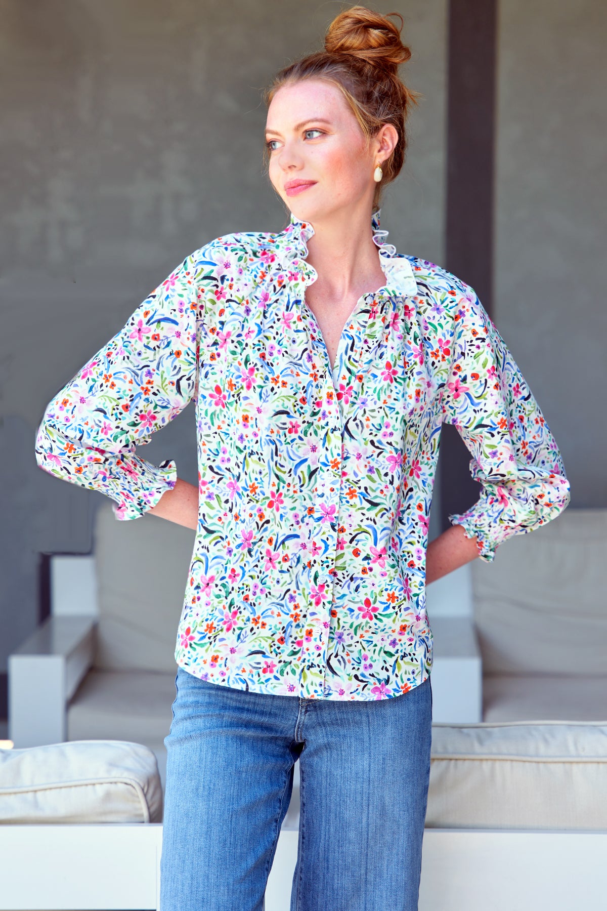 Model wears Finley Fiona white and pink floral shirt with ruffle neckline and 3/4 blouson sleeves.
