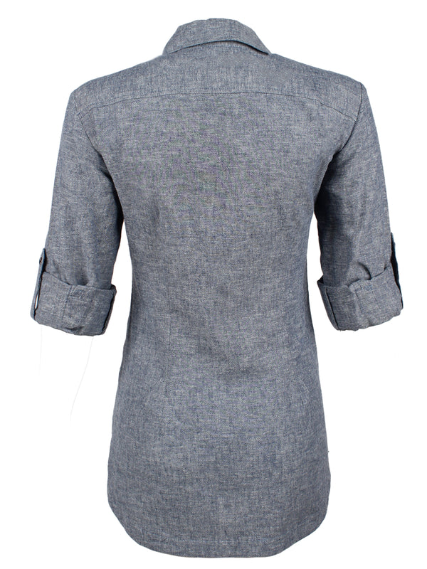 A rear view of the Finley Joey blouse, a semi-fitted button down blue designer shirt made with chambray denim hemp.