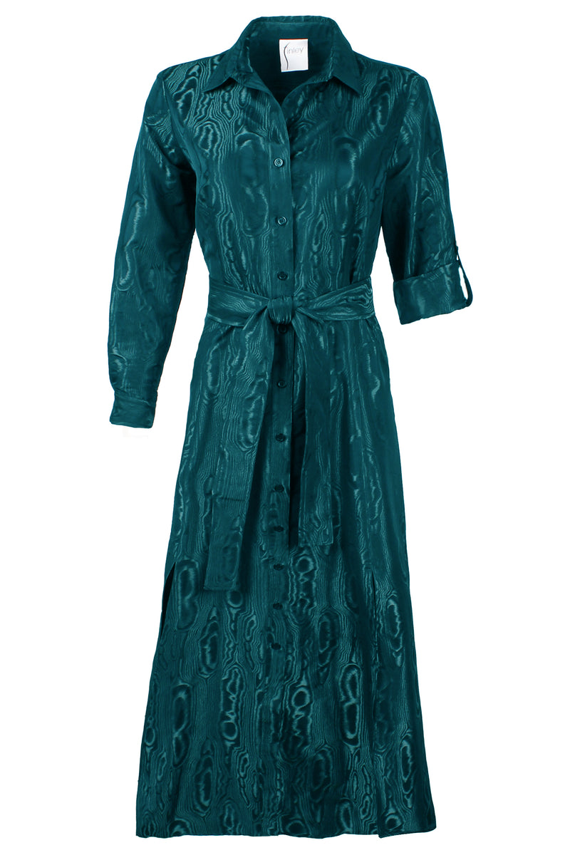 A front view of the Finley Laine dress, a teal long sleeve tie front maxi dress with tonal moire jacquard embroidery and a self-tie belt.