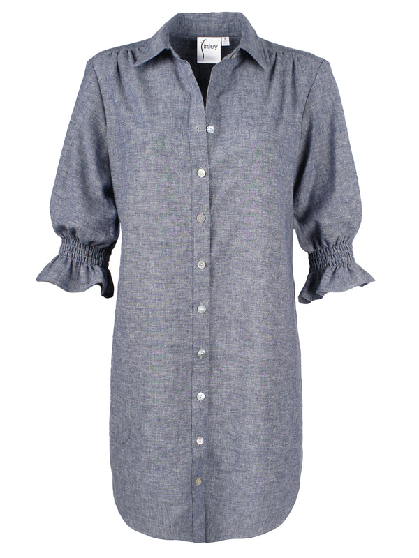 A front view of the Miller dress, a button down chambray designer shirtdress with a spread collar and elastic puff sleeve detail.