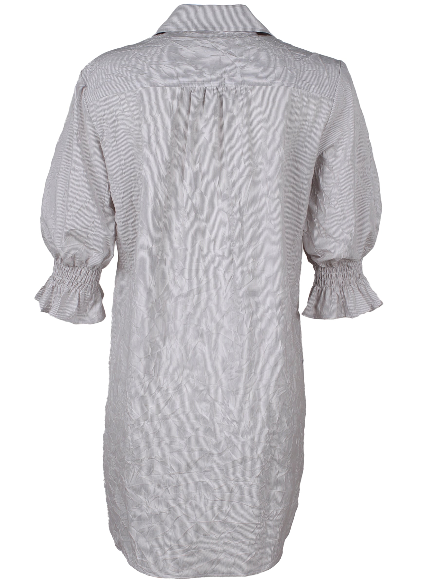 A rear view of the Finley Miller dress, a button down shirt dress with short puff sleeves in a teal paisley print