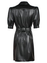 A rear view of the Finley Piper dress, a tie front black vegan leather button down midi shirt dress with short sleeves and a semi-fitted shape.