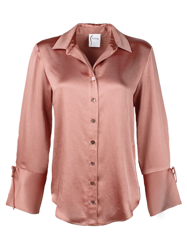 A front view of the Finley Rachel blouse, a rose gold satin button down oversize women's blouse with cuff self-ties and a point collar.