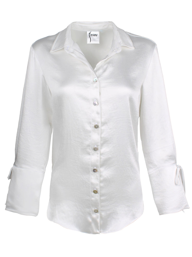 A front view of the Finley Rachel blouse, a ivory white satin button down oversize women's blouse with cuff self-ties and a point collar.