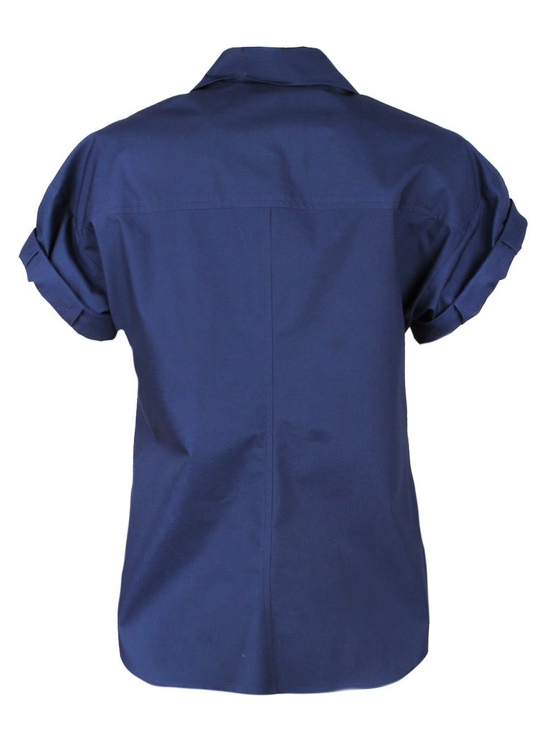 A rear view of the Finley Camp Shirt, a white cotton poplin shirt with short roll sleeves and a relaxed shape.