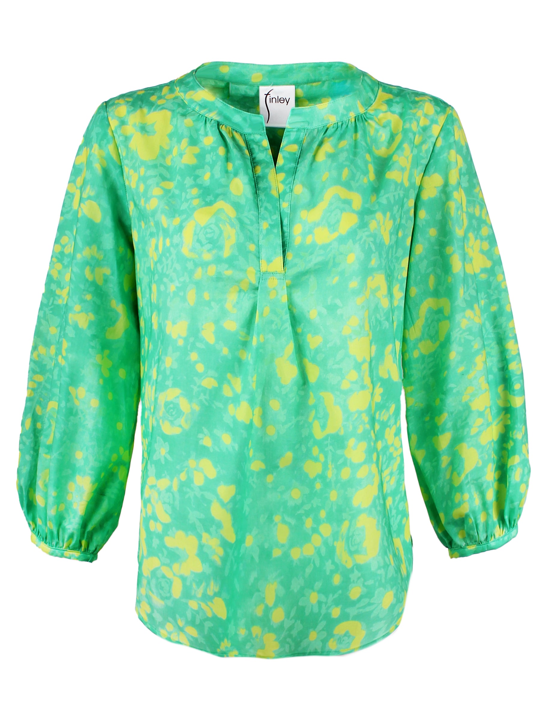 A front view of the Finley Stephanie top, a v-neck blouse with bracelet sleeves and a bright green and yellow floral print.
