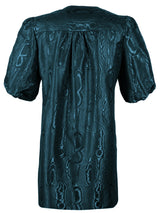 A rear view of Finley Tish dress, a v-neck puff sleeve popover midi dress with black and blue moire jacquard embroidery.
