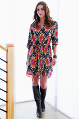 The Finley Carter shirtdress, a button-down tie-front shirt dress with a red and black flame print - model frontal