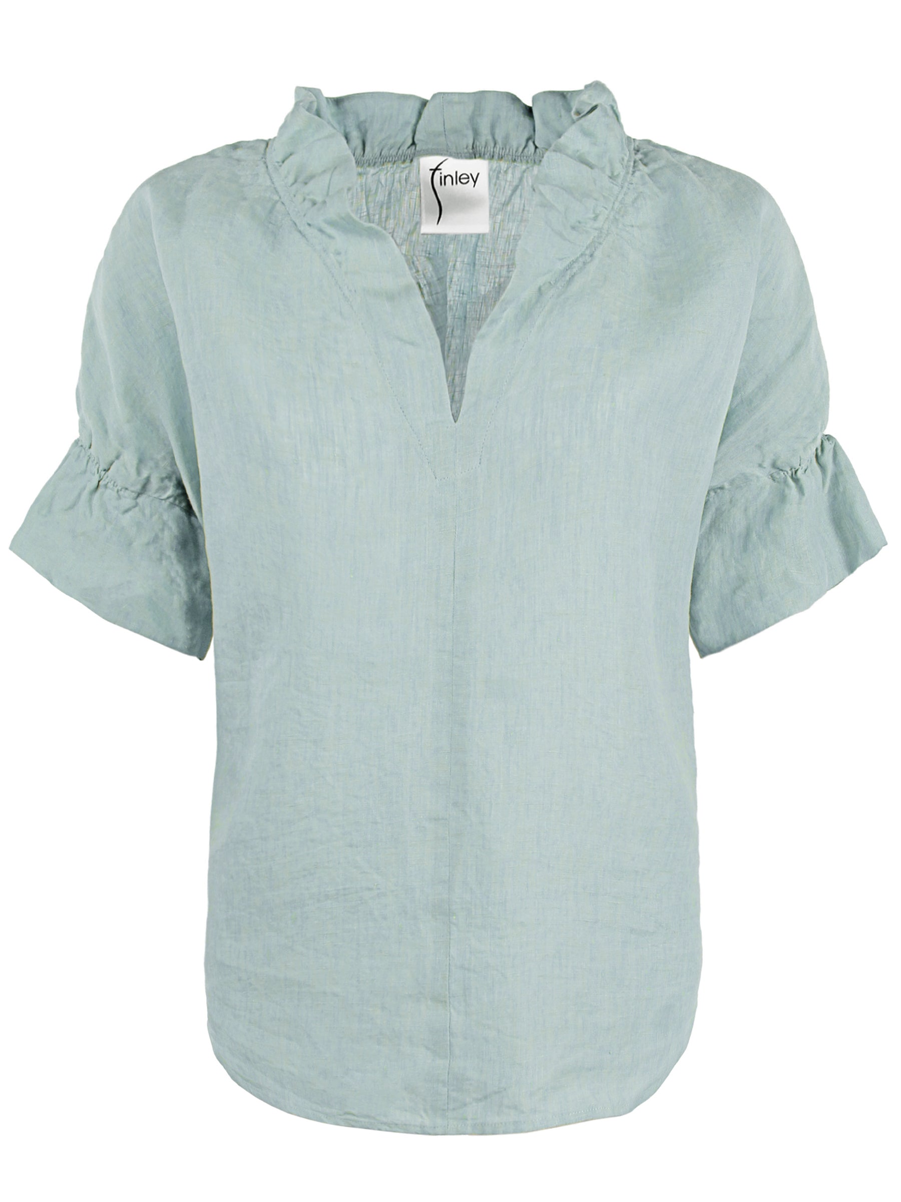 a front view of the Finley Crosby blouse with a popover design, washed linen fabric, seaglass green color, and ruffle collar & sleeve detail.
