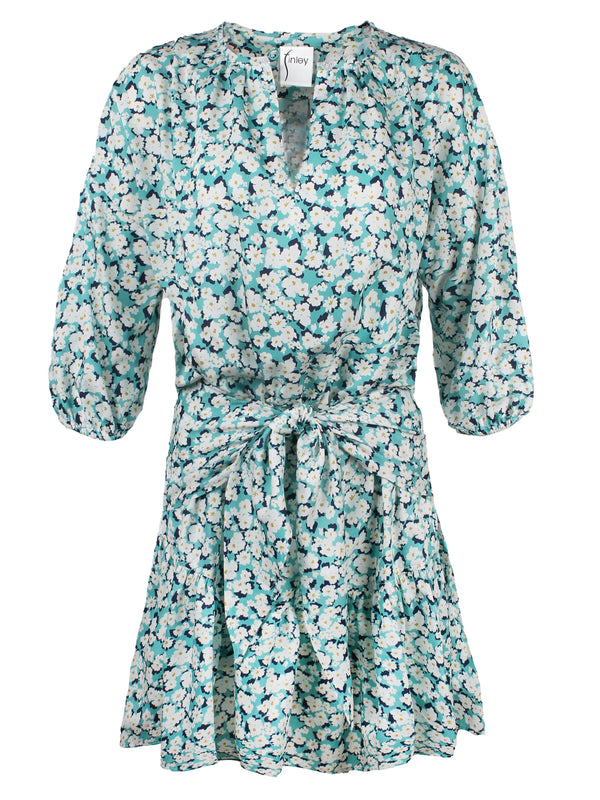 A front view of the Finley Coco dress, a peasant-style dress with a 3/4 sleeve, a relaxed fit, and a blue and white floral print.