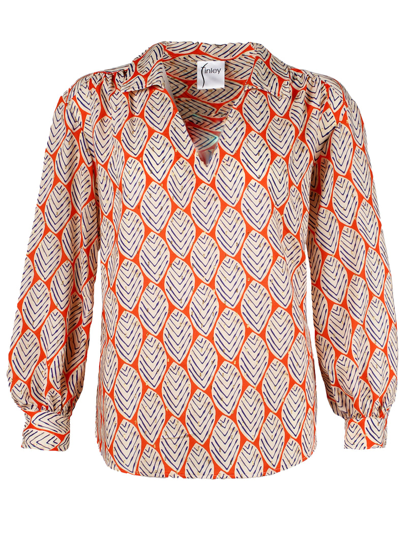 The Finley Davy blouse, a v-neck popover blouse with long puff sleeves and a orange and white leaf pattern.