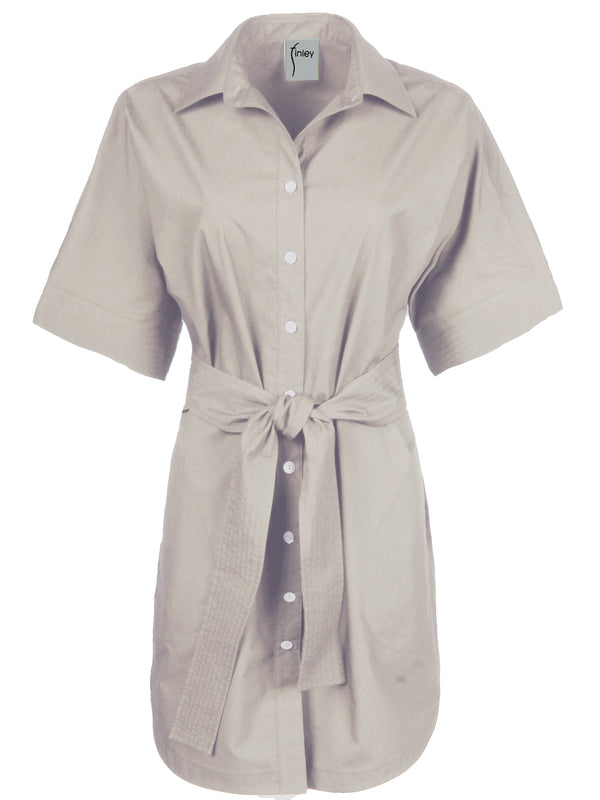 A front view of  the Finley Dolman dress, a relaxed fit cotton dress with a detachable self-belt and a sand white color.