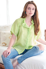 The Finley Frankie blouse, a casual key lime green washed linen short sleeve button-down blouse with ruffle collar detailing.