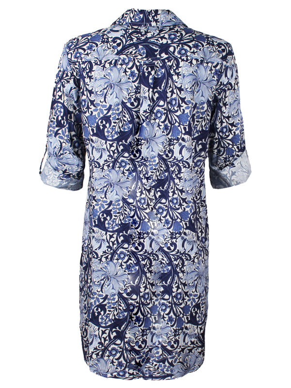 The Finley Jenna dress, a blue cotton floral print button-down shirt dress with a flounce hem and a relaxed fit.