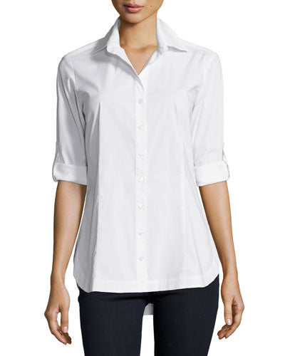 A fashion supermodel wearing the Finley Joey blouse, a semi-fitted button down white designer shirt with a vintage tailored shape.