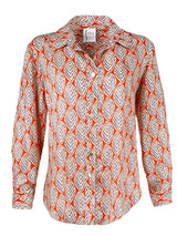 The Finley Mini-Monica blouse, a v-neck button-down blouse with a spread collar and a orange and white leaf pattern.