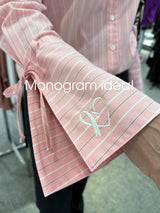 A  close up picture of the Finley Rachel blouse with a custom monogram.