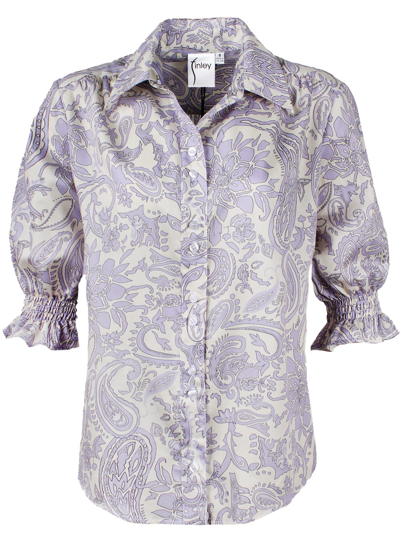 The Finley Sirena shirt, a shortsleeve button-down blouse with puff sleeves and a gray and white paisley print.
