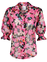 The Finley Sirena shirt, a popover ruffle women's blouse with ruffled short sleeves and a pink and black floral print.