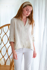 The Finley swing shirt, a peachy pink blush washed linen v-neck popover women's blouse with an inverted pleat.
