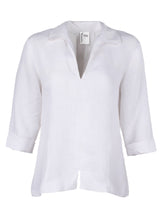 The Finley swing shirt, a white washed linen v-neck popover women's blouse with an inverted pleat.