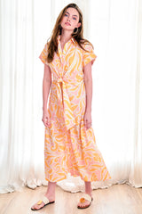 The Finley Tara shirt dress, a short sleeved 100% cotton maxi shirt dress with an orange floral tropical pattern.