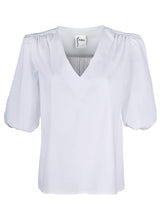 A front view of the Tish blouse, a casual white silky poplin pullover blouse with puffy sleeves and a relaxed fit.