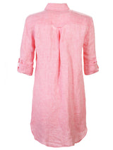 A back view of the Finley Alex dress, a peach pink washed linen button-down shirt dress with tabbed sleeves and a relaxed fit.