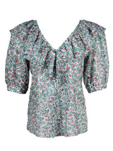 A front view of the Finley Ashleigh top, a cotton voile pullover blouse with a relaxed shape and a green and white floral print.
